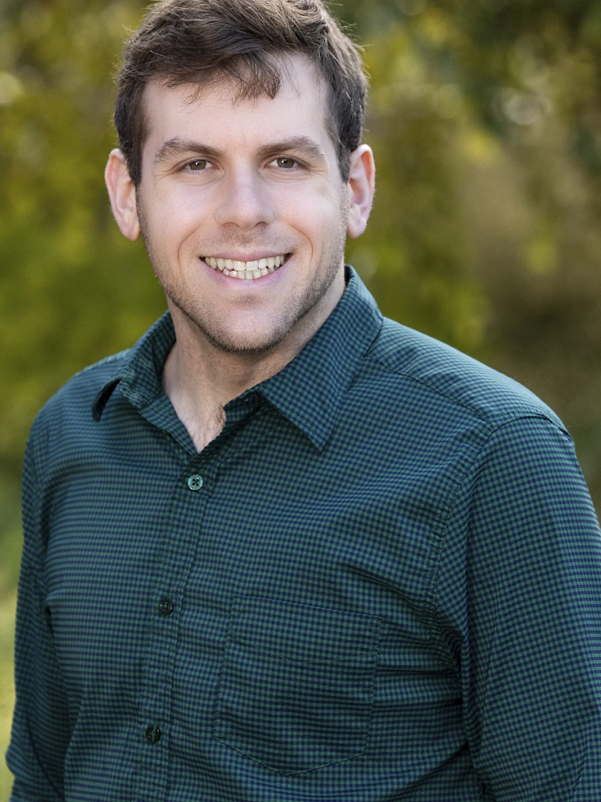 Ilan Goodman smiling outdoors